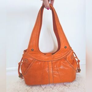 Vibrant Burnt Orange Hobo Bag with Textured Faux Leather and Metal Accen…